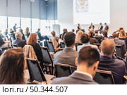 Interview and round table discussion at business convention and presentation. Audience at the conference hall. Business and entrepreneurship symposium. Стоковое фото, фотограф Matej Kastelic / Фотобанк Лори