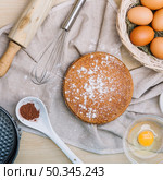 sponge cake with icing sugar ingredients wooden table. Стоковое фото, агентство Ingram Publishing / Фотобанк Лори