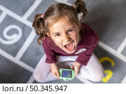 portrait little girl upset because game. Стоковое фото, агентство Ingram Publishing / Фотобанк Лори