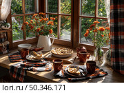 Cozy autumn kitchen with apple pie and fall decor by sunny window. Стоковое AI-изображение, AI-художник Мария Фадеева / Фотобанк Лори