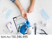 top view doctor giving covid vaccine. Стоковое фото, агентство Ingram Publishing / Фотобанк Лори