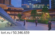 Osaka, Japan - Sep 25 2024, 4k, panoramic view of entrance group to Osaka City Station with modern geometric architectural designs, at evening with street light, Osaka, Japan. Редакционное видео, видеограф Сергей Богомяко / Фотобанк Лори