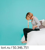 woman with hurting stomach. Стоковое фото, агентство Ingram Publishing / Фотобанк Лори