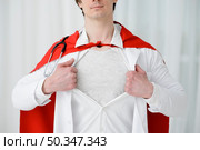 close up man tearing lab coat. Стоковое фото, агентство Ingram Publishing / Фотобанк Лори