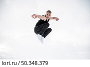 male dancer posing while mid air. Стоковое фото, агентство Ingram Publishing / Фотобанк Лори