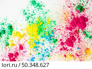 overhead view holi powder white background. Стоковое фото, агентство Ingram Publishing / Фотобанк Лори