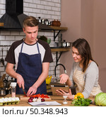 sweethearts cooking food using tablet. Стоковое фото, агентство Ingram Publishing / Фотобанк Лори