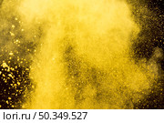 yellow cloud cosmetic powder black background. Стоковое фото, агентство Ingram Publishing / Фотобанк Лори