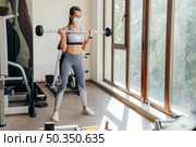 woman exercising gym with equipment mask. Стоковое фото, агентство Ingram Publishing / Фотобанк Лори