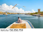 View of the Great Nile in Aswan. Boat on the river Nile. Стоковое фото, агентство Ingram Publishing / Фотобанк Лори