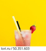 misted glass cocktail with strawberry straws. Стоковое фото, агентство Ingram Publishing / Фотобанк Лори