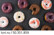 set delicious sweet bitten donuts with colorful coating. Стоковое фото, агентство Ingram Publishing / Фотобанк Лори