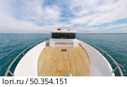 Yacht panorama on deck. Calm sea water at day. Modern and luxury transportation. Стоковое фото, агентство Ingram Publishing / Фотобанк Лори