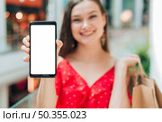 smiley girl holding her phone. Стоковое фото, агентство Ingram Publishing / Фотобанк Лори