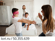boy with blindfold caught mother during playing blind man s buff. Стоковое фото, агентство Ingram Publishing / Фотобанк Лори