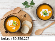 flat lay bowls with pumpkin cream soup. Стоковое фото, агентство Ingram Publishing / Фотобанк Лори