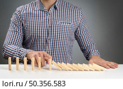 high angle domino blocks falling off. Стоковое фото, агентство Ingram Publishing / Фотобанк Лори