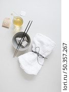 teabag oil pumice stone incense stick tied napkin white surface. Стоковое фото, агентство Ingram Publishing / Фотобанк Лори
