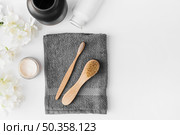 black towel brush moisturizing cream flowers container white background. Стоковое фото, агентство Ingram Publishing / Фотобанк Лори