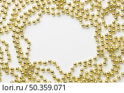 view golden beads frame. Стоковое фото, агентство Ingram Publishing / Фотобанк Лори