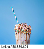 OLYMPUS DIGITAL CAMERA. close up view milkshake with marshmallow chocolate topping. Стоковое фото, агентство Ingram Publishing / Фотобанк Лори