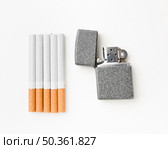 cigarettes with lighter beside. Стоковое фото, агентство Ingram Publishing / Фотобанк Лори