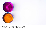 pink orange holi color powder bowl white background. Стоковое фото, агентство Ingram Publishing / Фотобанк Лори