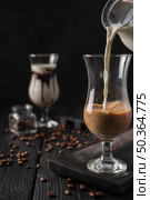 milk poured into transparent glass. Стоковое фото, агентство Ingram Publishing / Фотобанк Лори