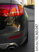 stylish rear light new black automobile route. Стоковое фото, агентство Ingram Publishing / Фотобанк Лори