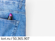 donuts lipstick eyelash curler toe divider yellow background. Стоковое фото, агентство Ingram Publishing / Фотобанк Лори