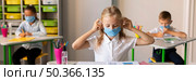 front view kids protecting themselves with medical masks. Стоковое фото, агентство Ingram Publishing / Фотобанк Лори