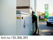 lateral view pumps car refill. Стоковое фото, агентство Ingram Publishing / Фотобанк Лори
