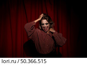 medium shot make up woman clown looking down. Стоковое фото, агентство Ingram Publishing / Фотобанк Лори