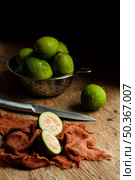 sliced guava fruit wooden table. Стоковое фото, агентство Ingram Publishing / Фотобанк Лори