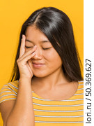 woman rubbing her face with hand. Стоковое фото, агентство Ingram Publishing / Фотобанк Лори