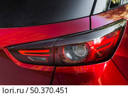 stylish rear light new red auto. Стоковое фото, агентство Ingram Publishing / Фотобанк Лори