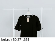 hanging black blouse. Стоковое фото, агентство Ingram Publishing / Фотобанк Лори