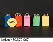 bright packets with sale label. Стоковое фото, агентство Ingram Publishing / Фотобанк Лори