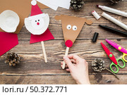 close up woman s handholding props made with paper wooden desk. Стоковое фото, агентство Ingram Publishing / Фотобанк Лори