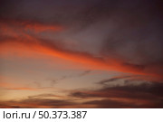 beautiful clouded night sky with red shades. Стоковое фото, агентство Ingram Publishing / Фотобанк Лори