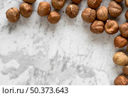 close up hazel nuts rough white wallpaper. Стоковое фото, агентство Ingram Publishing / Фотобанк Лори