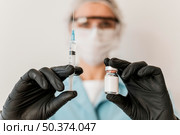 front view female doctor with vaccine gloves. Стоковое фото, агентство Ingram Publishing / Фотобанк Лори