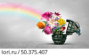 No War concept as a grenade weapon and flowers as a symbol for peace and hope as an unexploded bomb or disarmed explosive device with 3D illustration elements. Стоковое фото, агентство Ingram Publishing / Фотобанк Лори