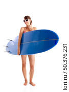Beautiful young woman posing with a surfboard, isolated on white. Стоковое фото, агентство Ingram Publishing / Фотобанк Лори