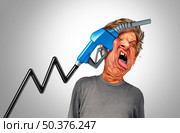 Pain at the gas pump and economic challenge or rising fuel prices and oil increase fuel concept or painful increasing crude petroleum and fossil energy with 3D illustration elements. Стоковое фото, агентство Ingram Publishing / Фотобанк Лори