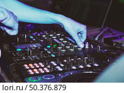 DJ mixes tracks at a party. DJ control panel. Стоковое фото, агентство Ingram Publishing / Фотобанк Лори