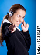 Portrait of a beautiful and young businesswoman with headsets. Стоковое фото, агентство Ingram Publishing / Фотобанк Лори