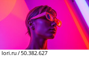 Futuristic portrait of cool woman in stylish glasses under pink and orange neon light, beautiful cyberpunk or metaverse fashion concept. Стоковое AI-изображение, AI-художник Павел Муравьев / Фотобанк Лори