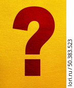 Interrogation point over a yellow tissue background. Стоковое фото, агентство Ingram Publishing / Фотобанк Лори