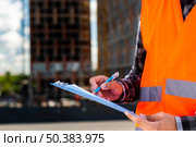 close up construction engineer writing. Стоковое фото, агентство Ingram Publishing / Фотобанк Лори